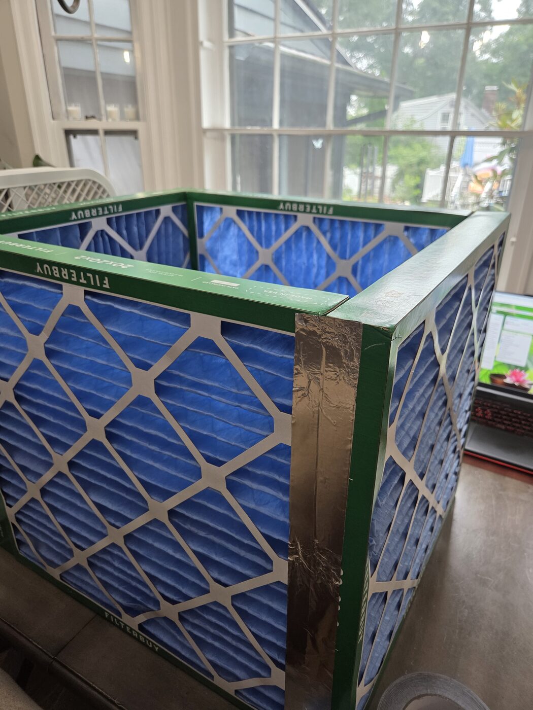 Close-up of the taped corners of the filter cube.