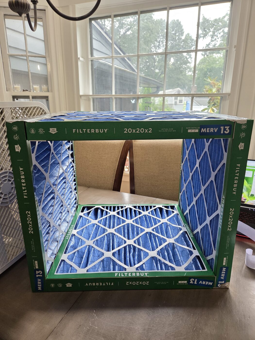 The finished four-filter cube with the bottom sealed by a cardboard panel.