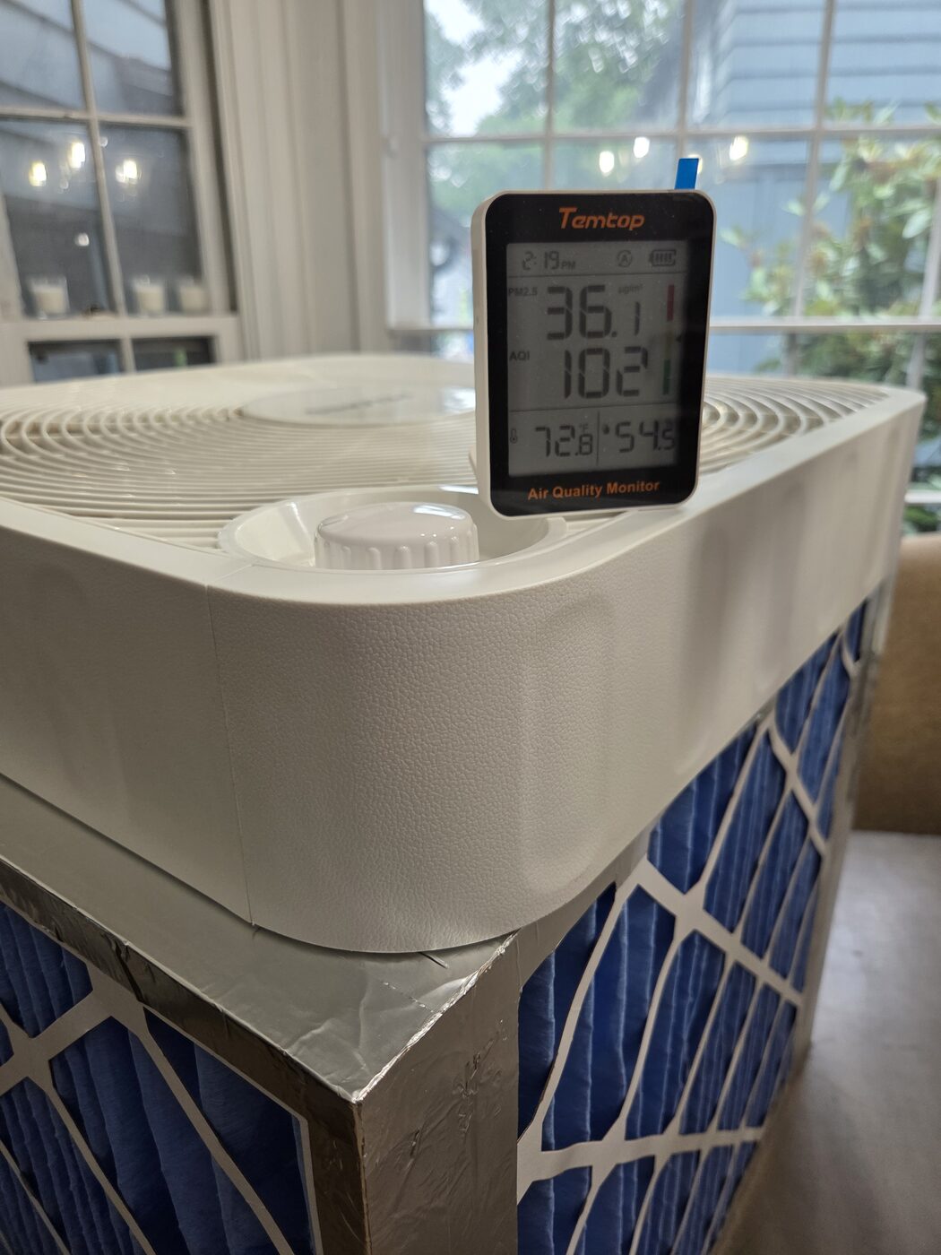 The Temtop monitor at 2:19 PM reading PM2.5 of 36.1 and an AQI of 102.